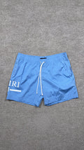 Amiri Baby Blue MA Bar Swim Trunks